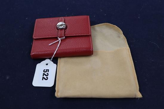 A Hermes, Paris red leather purse and cloth cover